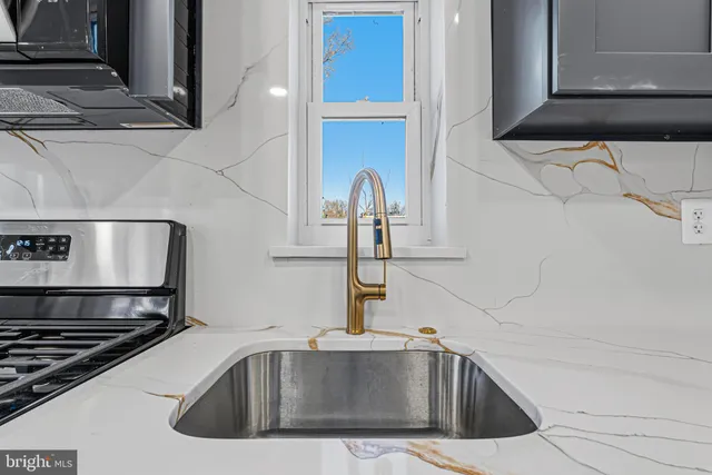 a kitchen with cabinets and stainless steel appliances