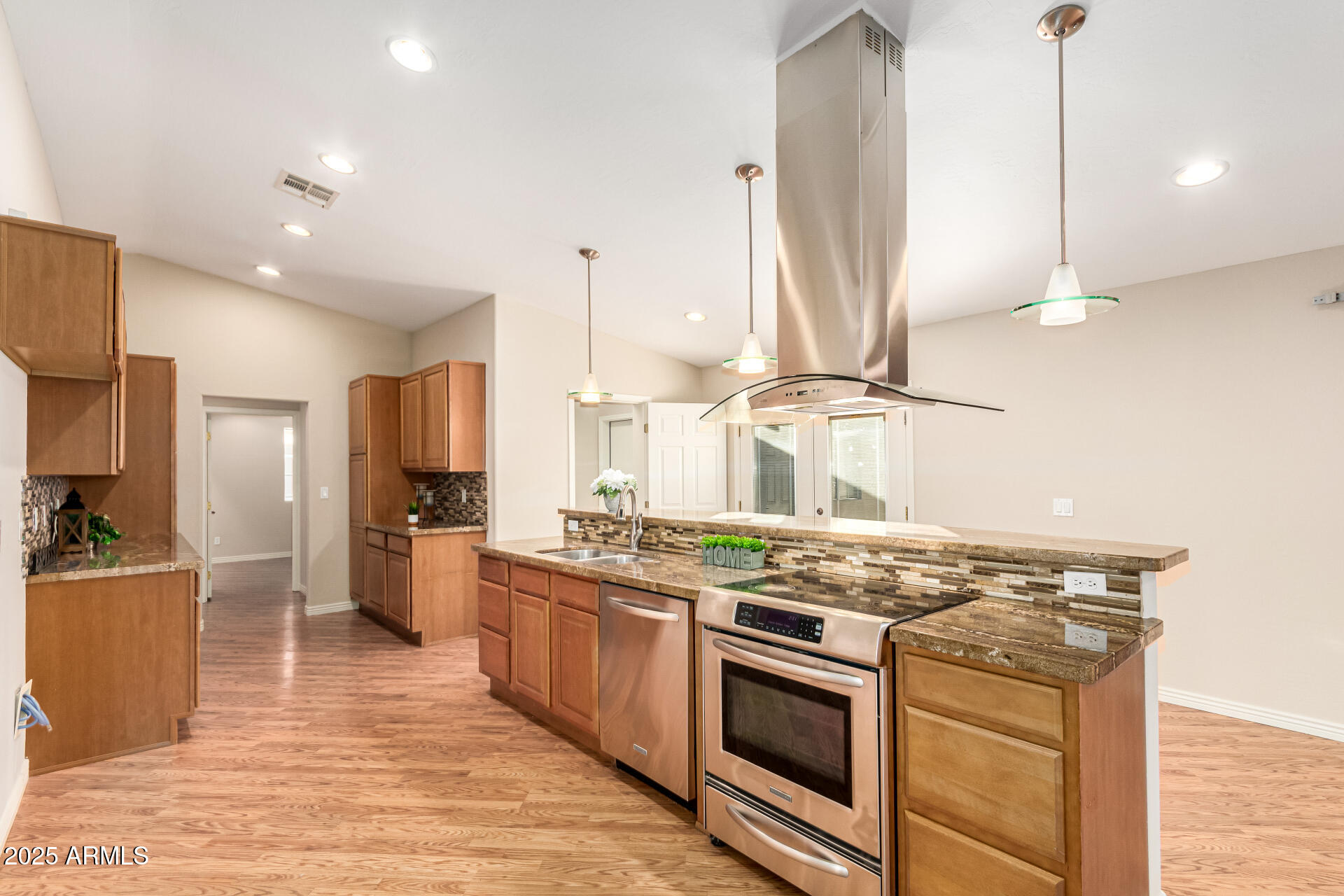 4112 4th Avenue Northwest Phoenix, AZ 85013 - Photo 12 of 39 a kitchen with stainless steel appliances granite countertop a stove a sink and a refrigerator
