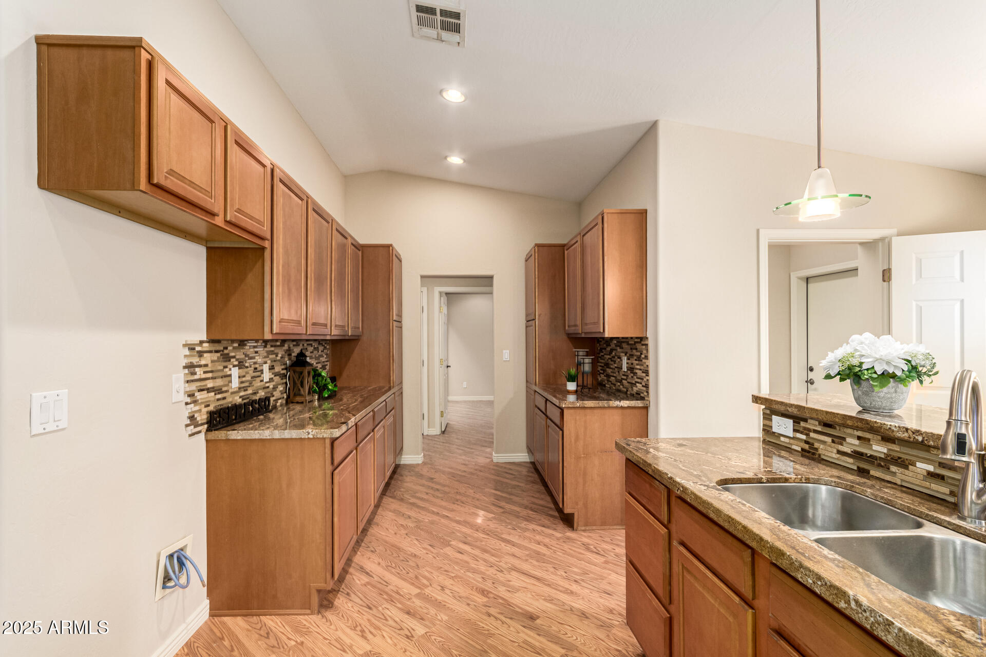 4112 4th Avenue Northwest Phoenix, AZ 85013 - Photo 13 of 39 a kitchen with stainless steel appliances granite countertop a sink stove and refrigerator