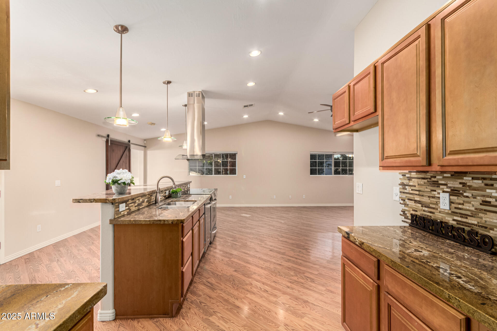 4112 4th Avenue Northwest Phoenix, AZ 85013 - Photo 14 of 39 a kitchen with stainless steel appliances granite countertop a sink a stove and a wooden floors