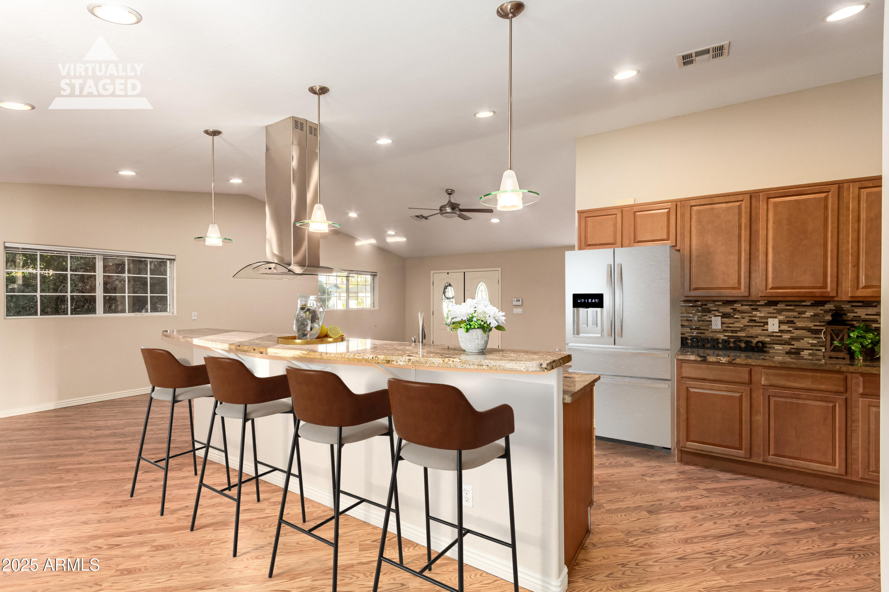 4112 4th Avenue Northwest Phoenix, AZ 85013 - Photo 15 of 39 a kitchen with stainless steel appliances kitchen island granite countertop a kitchen island a stove a dining table and chairs