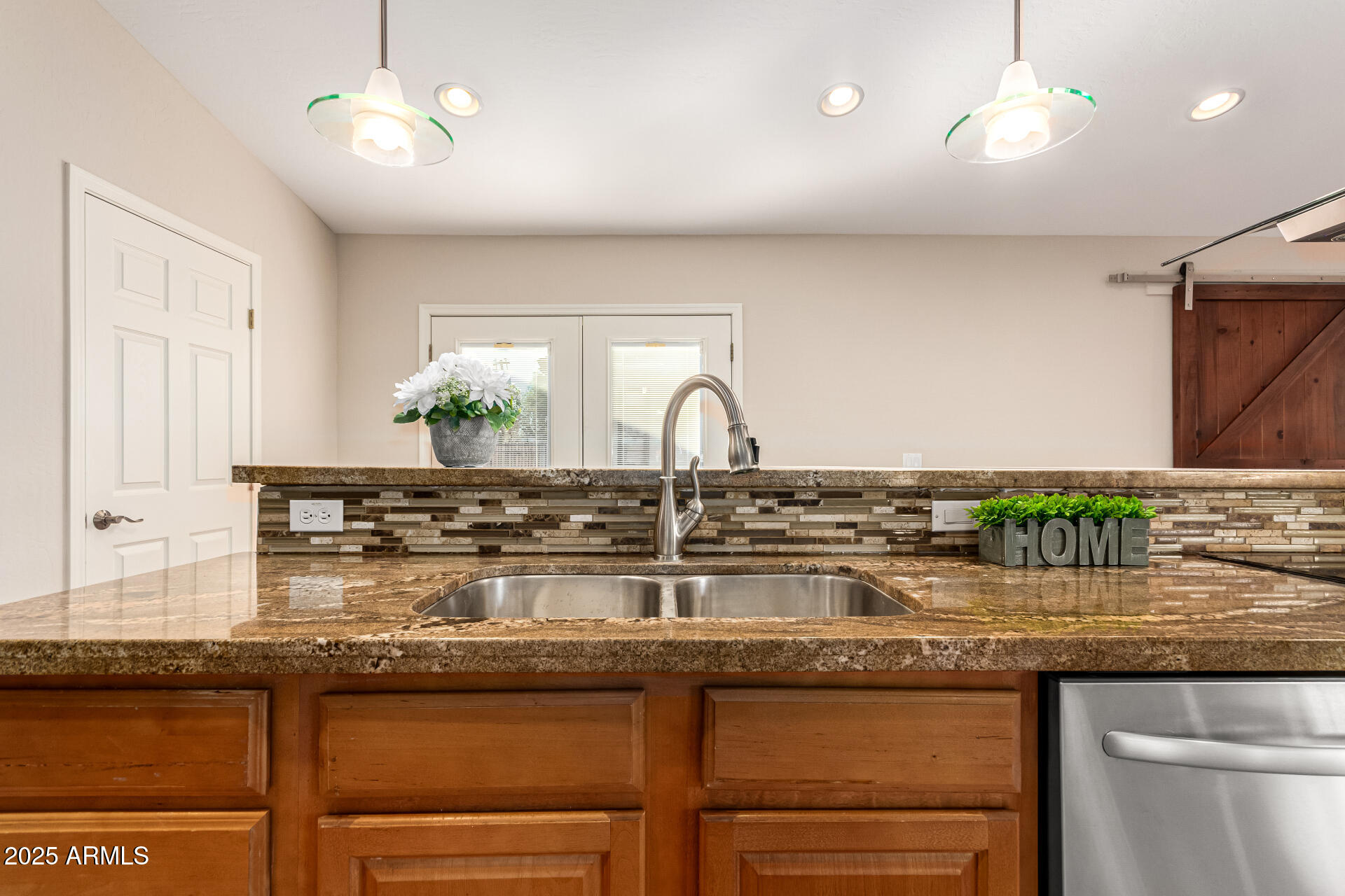 4112 4th Avenue Northwest Phoenix, AZ 85013 - Photo 17 of 39 a kitchen with a sink and chandelier