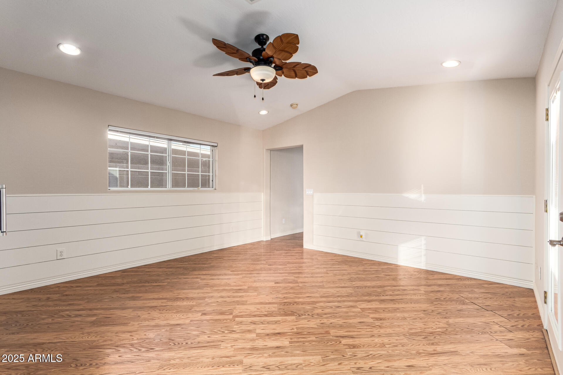 4112 4th Avenue Northwest Phoenix, AZ 85013 - Photo 20 of 39 a view of empty room with wooden floor and window
