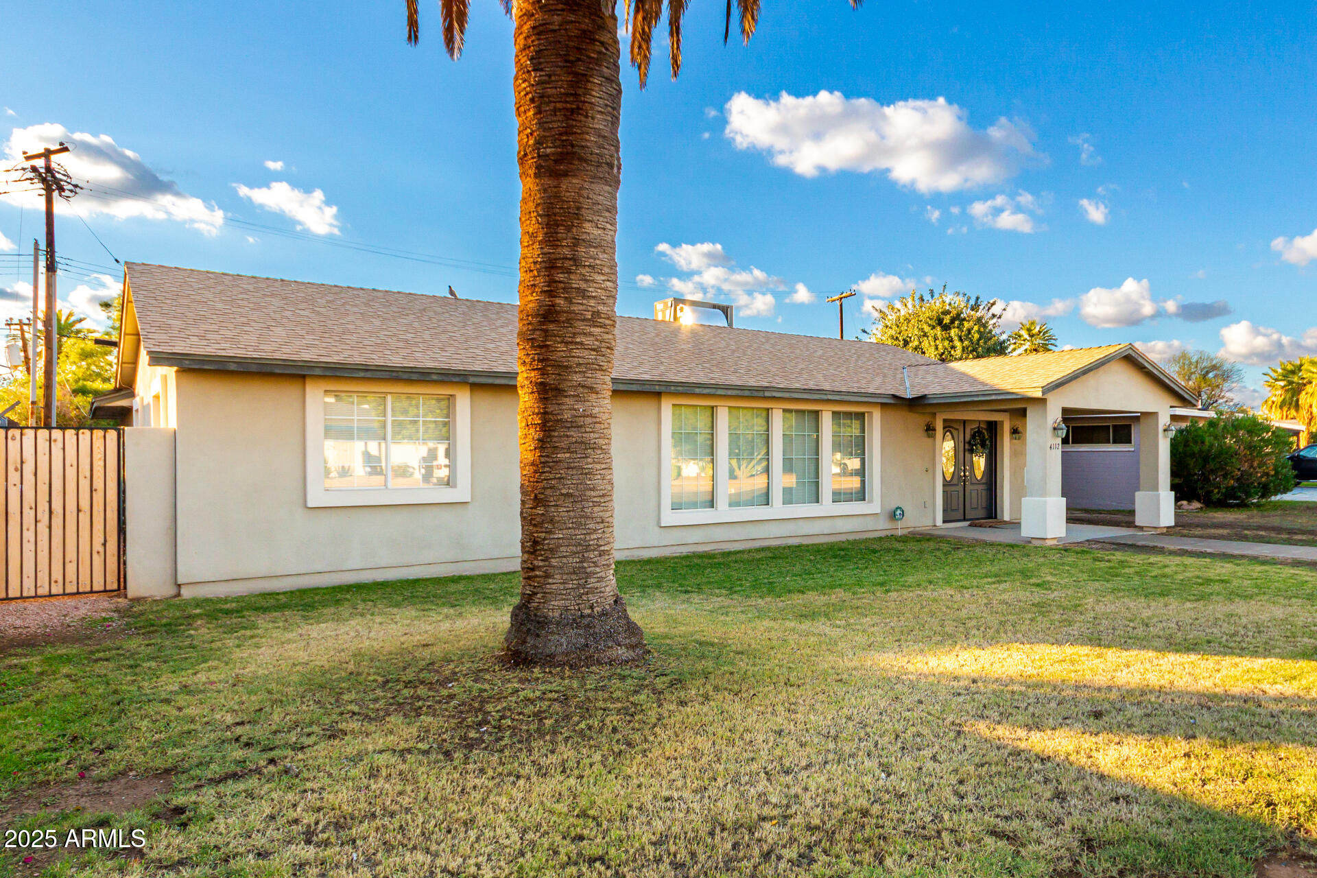 4112 4th Avenue Northwest Phoenix, AZ 85013 - Photo 2 of 39 a front view of a house with a garden and patio