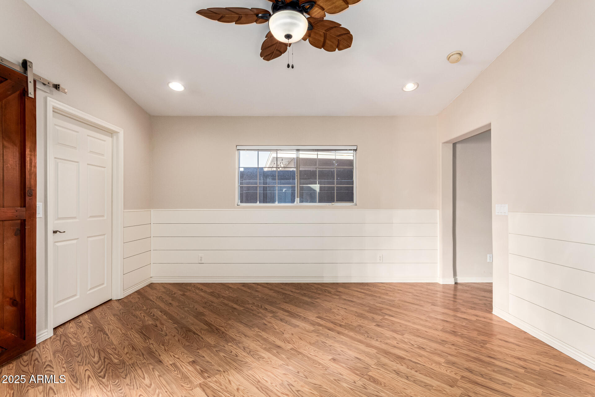4112 4th Avenue Northwest Phoenix, AZ 85013 - Photo 21 of 39 a view of empty room with wooden floor and fan