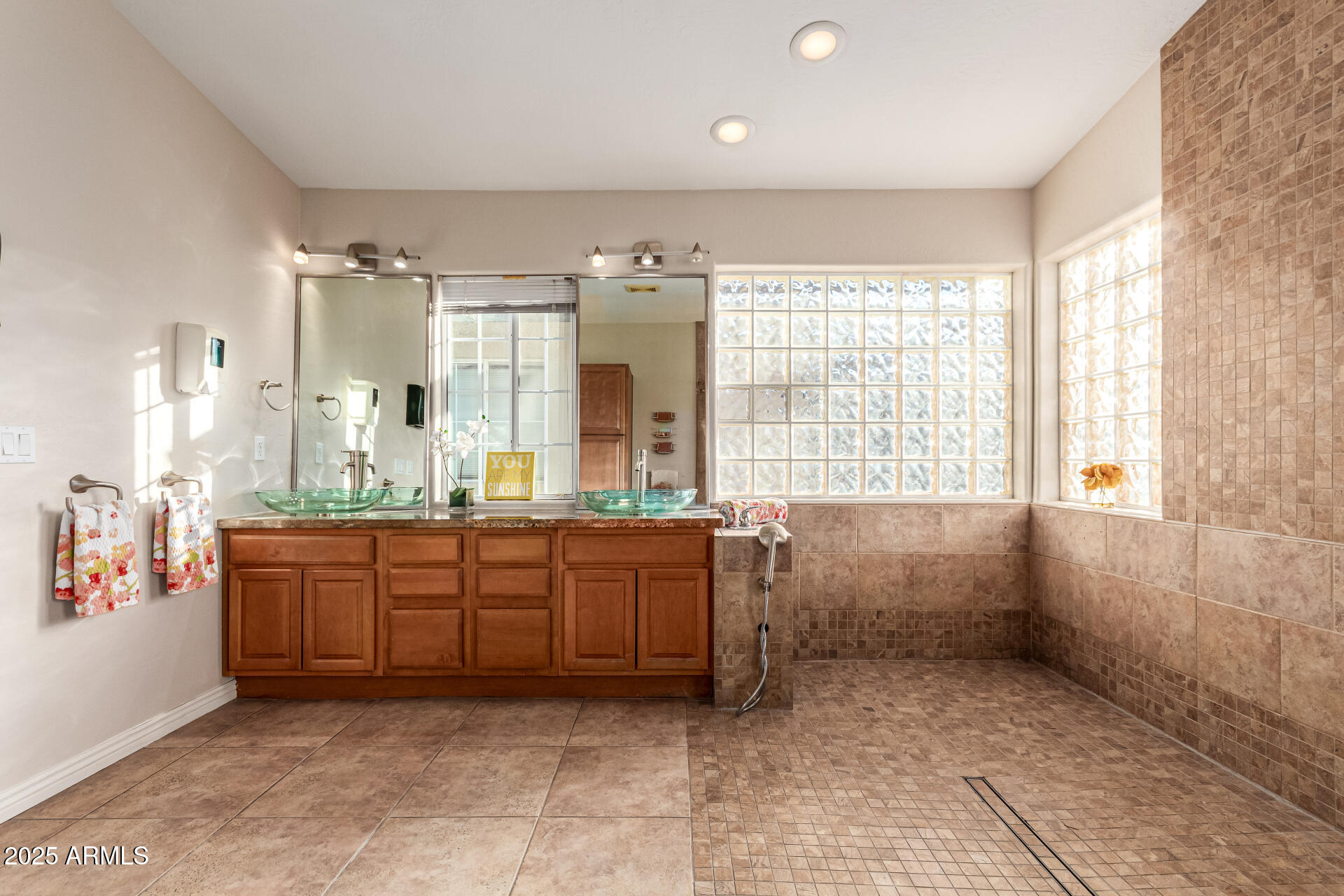 4112 4th Avenue Northwest Phoenix, AZ 85013 - Photo 25 of 39 a large bathroom with a granite countertop tub sink and mirror