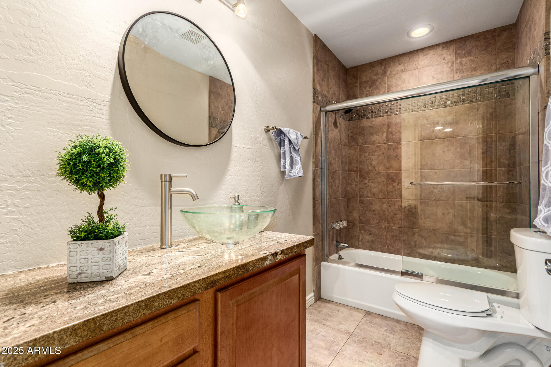 4112 4th Avenue Northwest Phoenix, AZ 85013 - Photo 28 of 39 a bathroom with a granite countertop sink toilet and shower