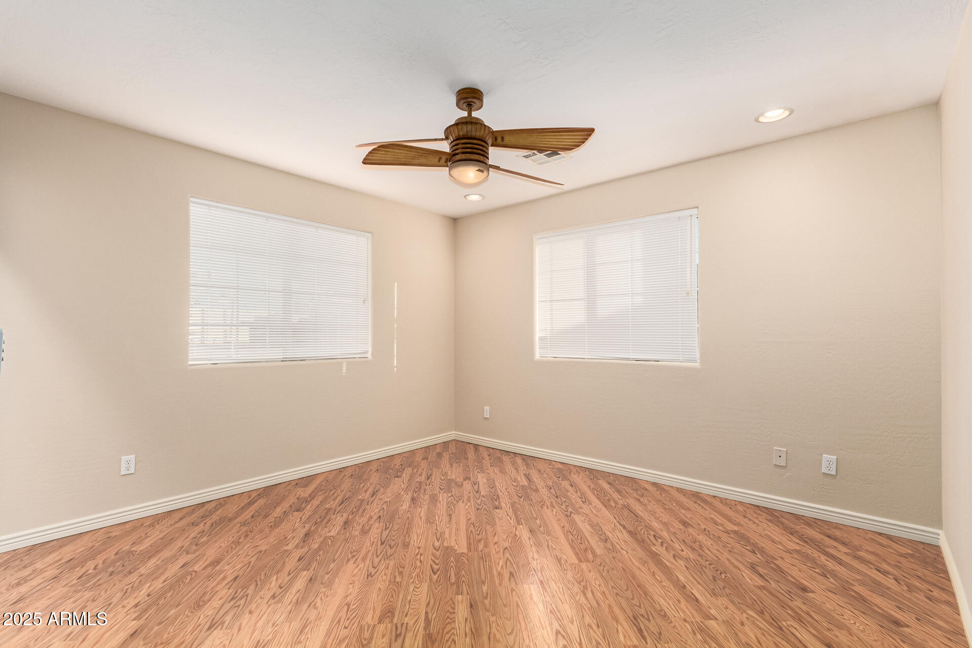 4112 4th Avenue Northwest Phoenix, AZ 85013 - Photo 29 of 39 a view of empty room with wooden floor and fan