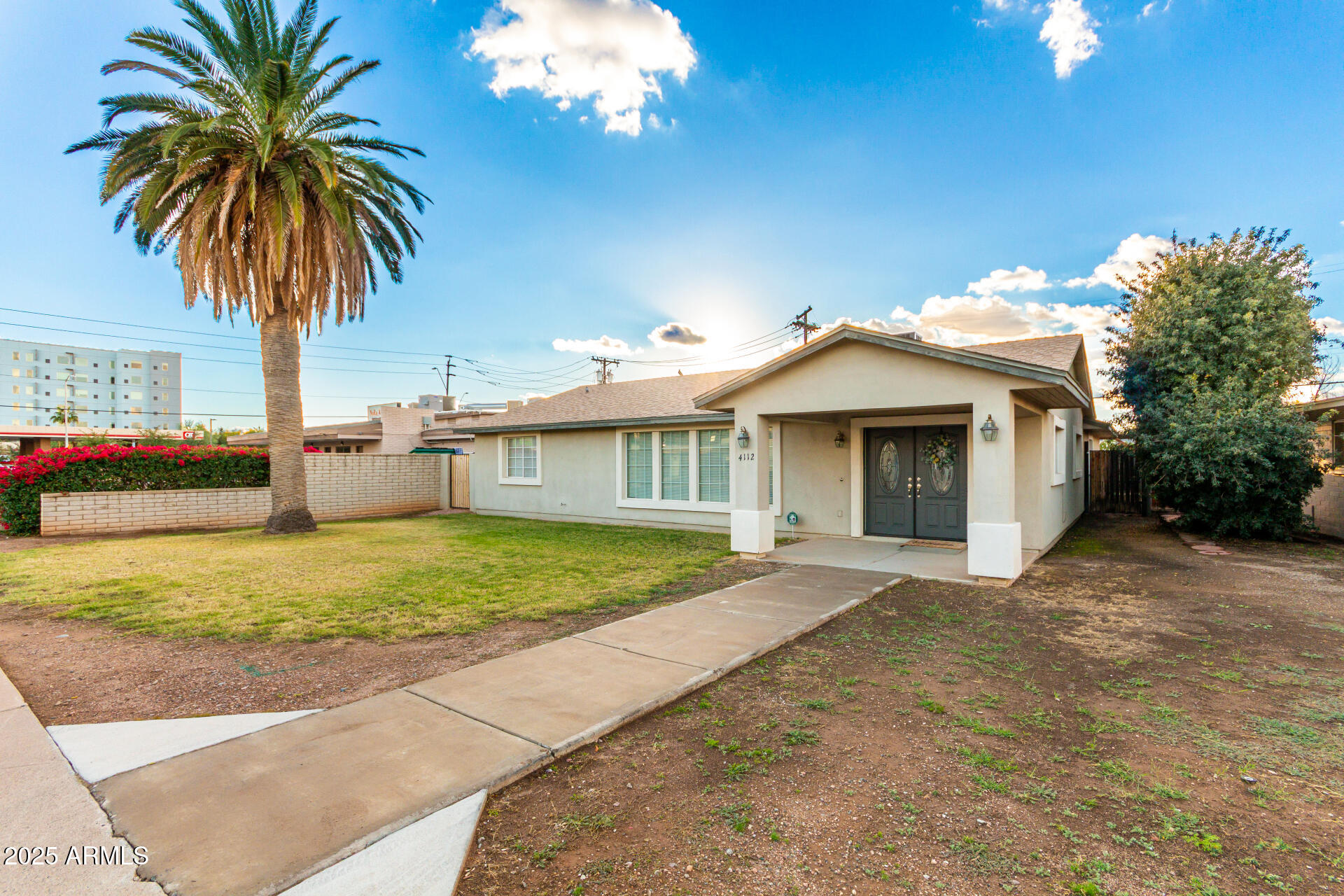 4112 4th Avenue Northwest Phoenix, AZ 85013 - Photo 3 of 39 a front view of house with yard and trees