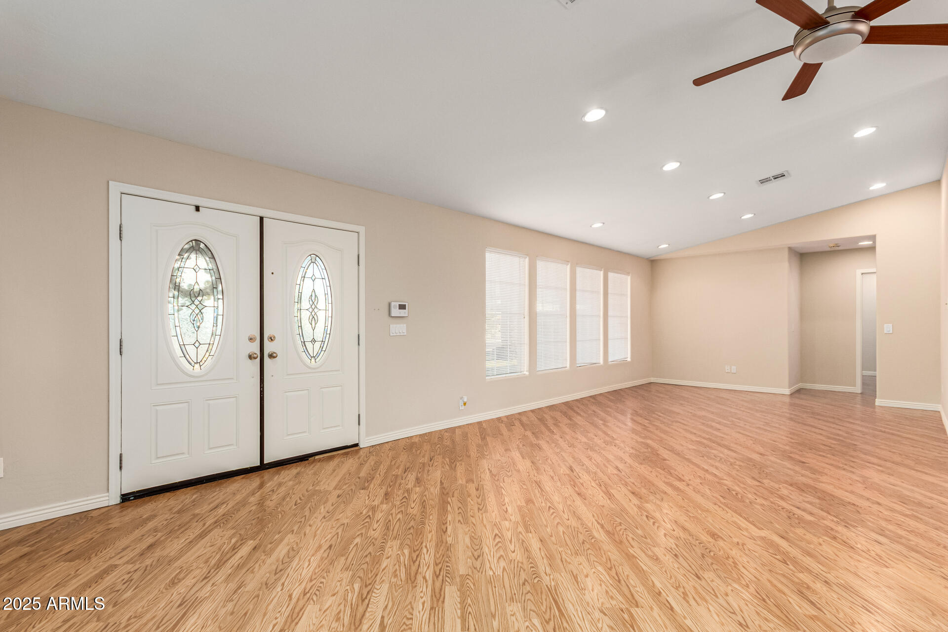 4112 4th Avenue Northwest Phoenix, AZ 85013 - Photo 5 of 39 a view of empty room with wooden floor and fan