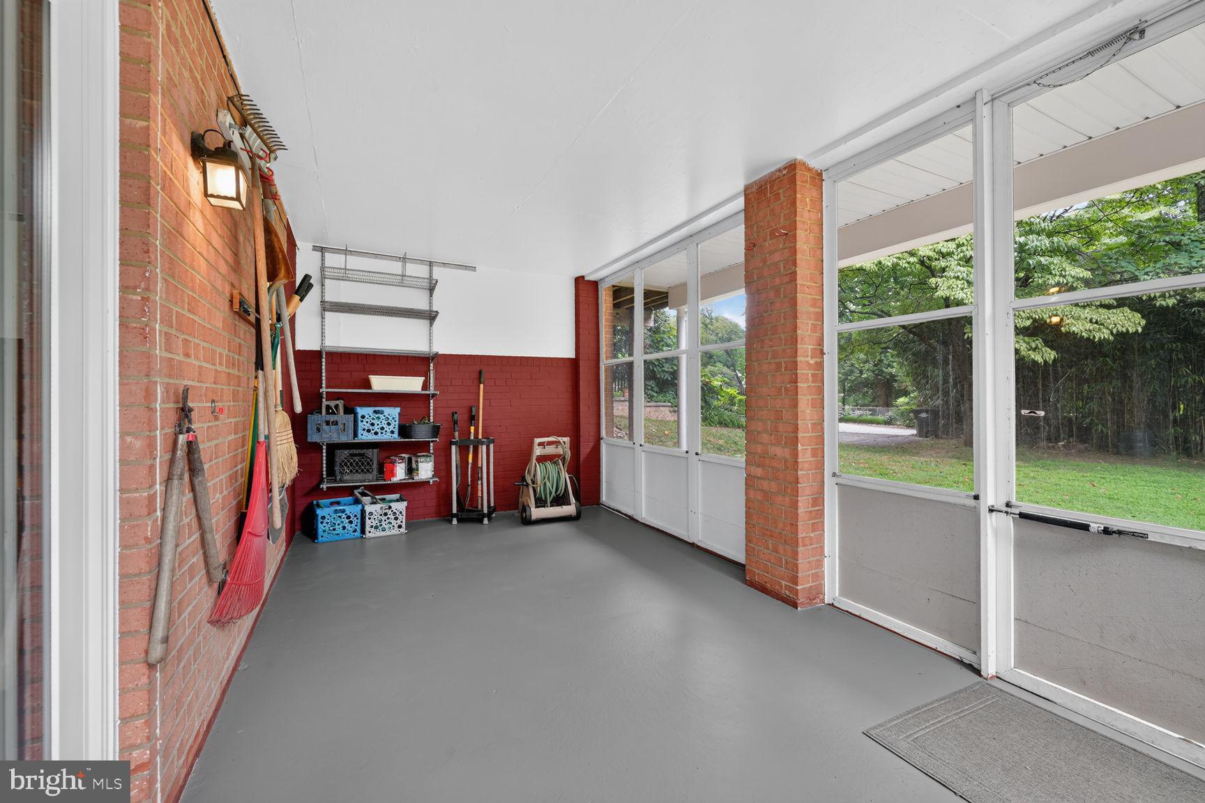 4605 Reno Road Northwest Washington, DC 20008 - Photo 43 of 49 an empty room with furniture and floor to ceiling window