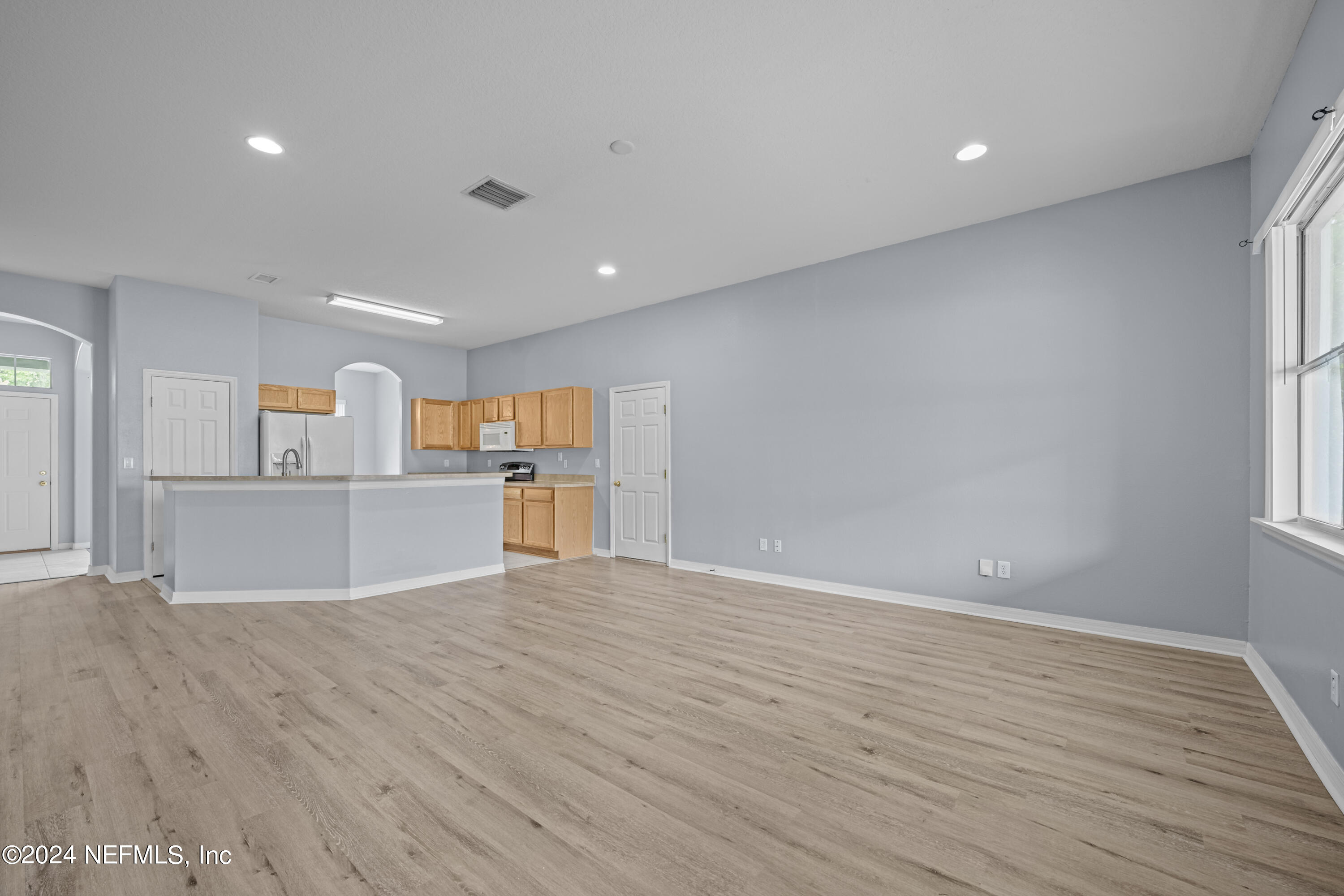 26 Zonal Geranium Trail Palm Coast, FL 32164 - Photo 15 of 35 a view of kitchen with wooden floor and windows