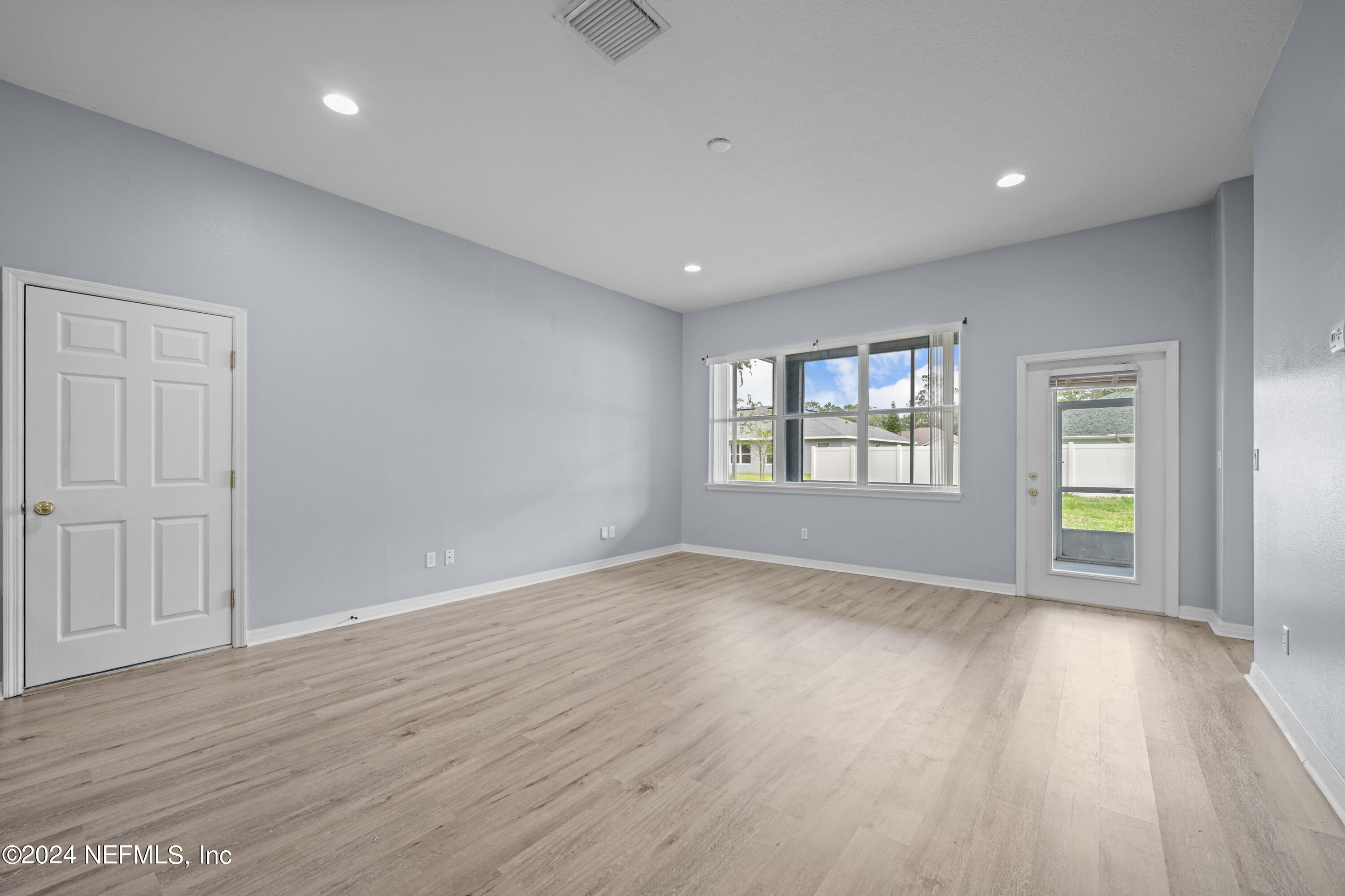 26 Zonal Geranium Trail Palm Coast, FL 32164 - Photo 16 of 35 wooden floor in an empty room with a window