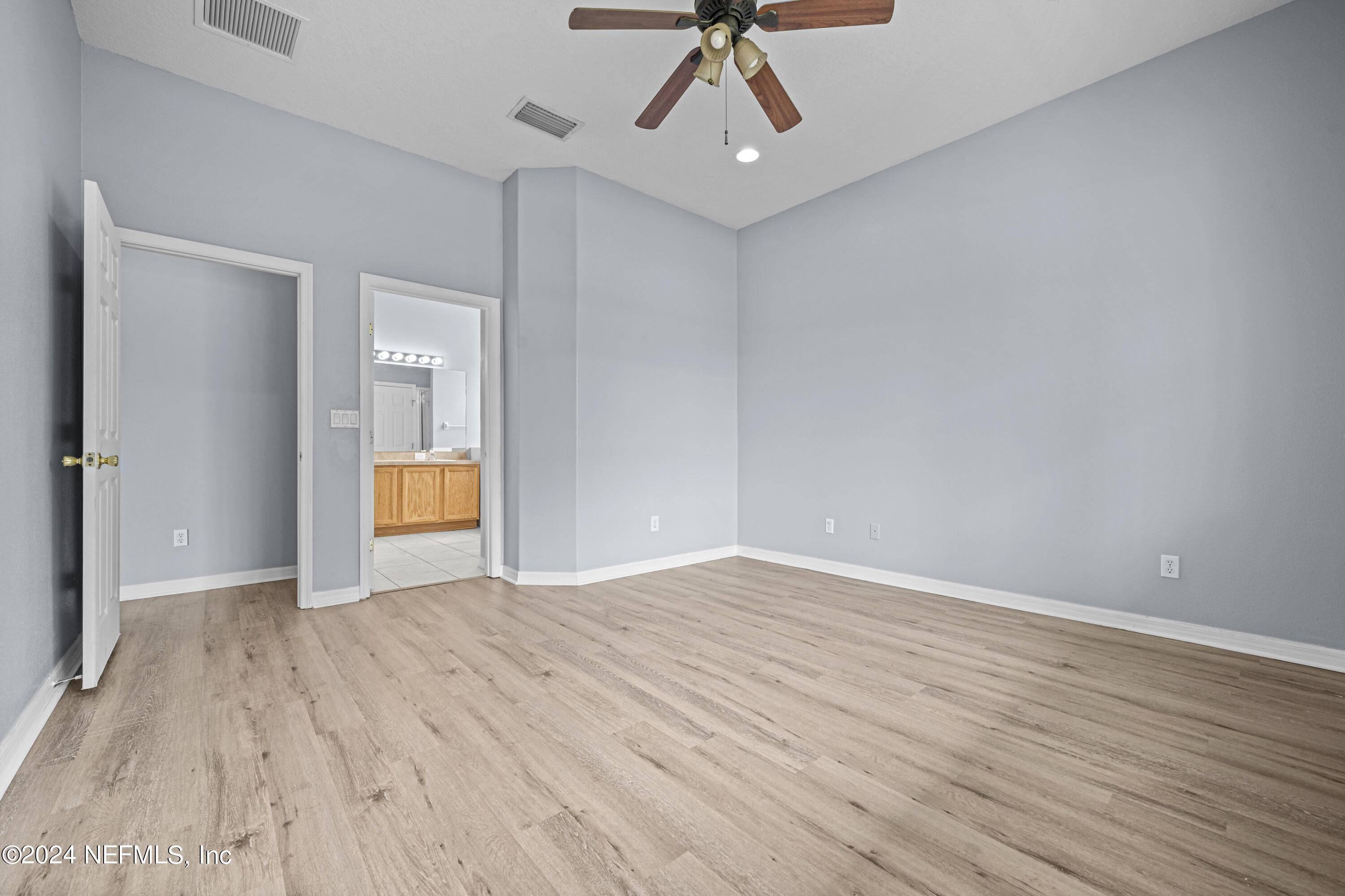 26 Zonal Geranium Trail Palm Coast, FL 32164 - Photo 20 of 35 wooden floor in an empty room with a window