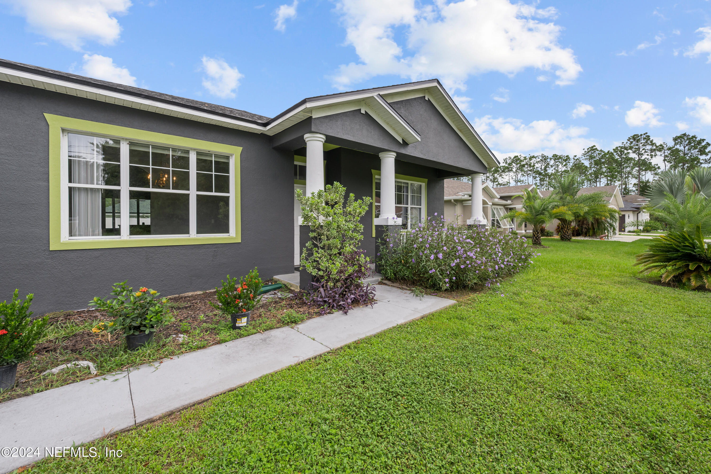 26 Zonal Geranium Trail Palm Coast, FL 32164 - Photo 2 of 35 front view of a house with a yard
