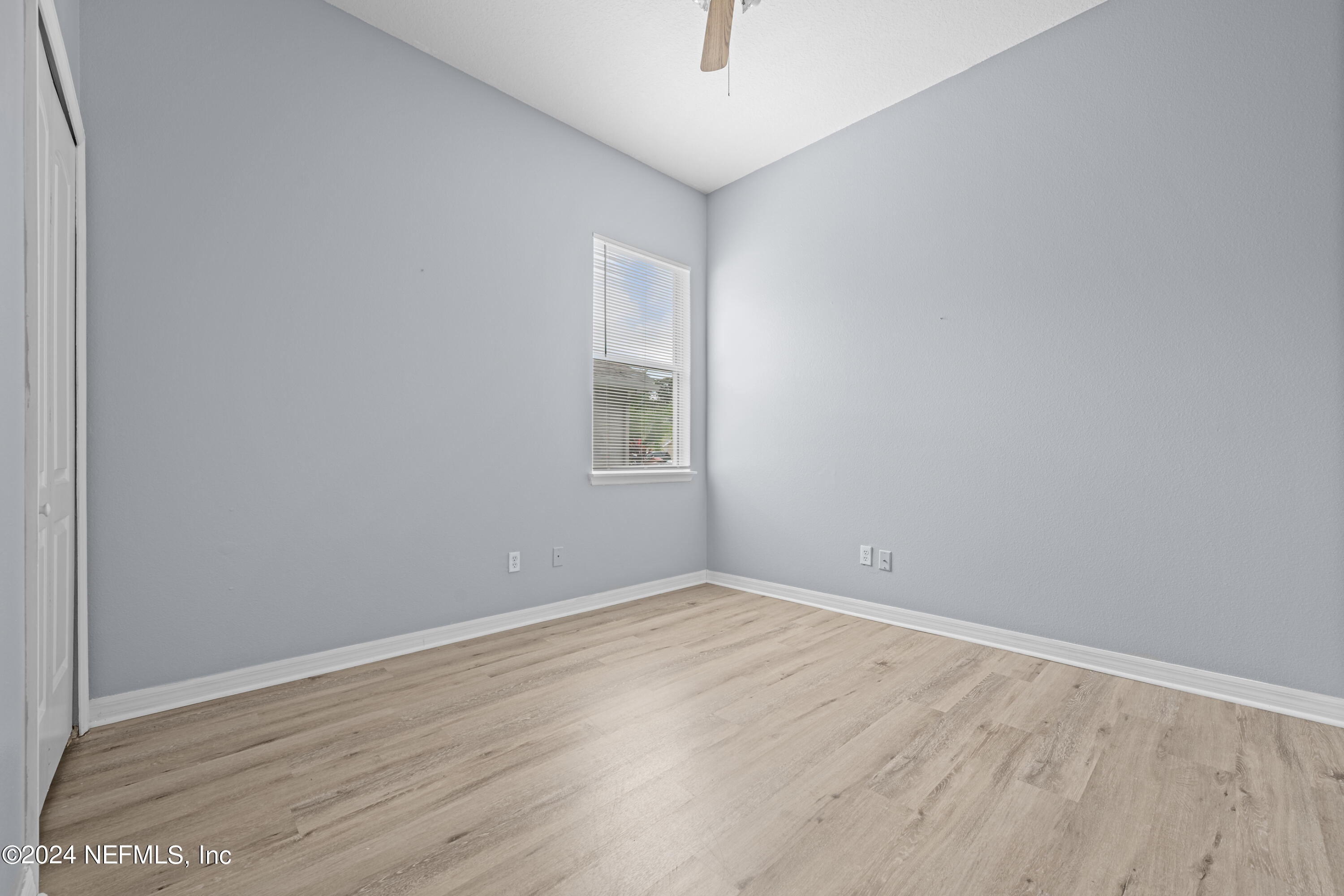 26 Zonal Geranium Trail Palm Coast, FL 32164 - Photo 24 of 35 an empty room with wooden floor and windows