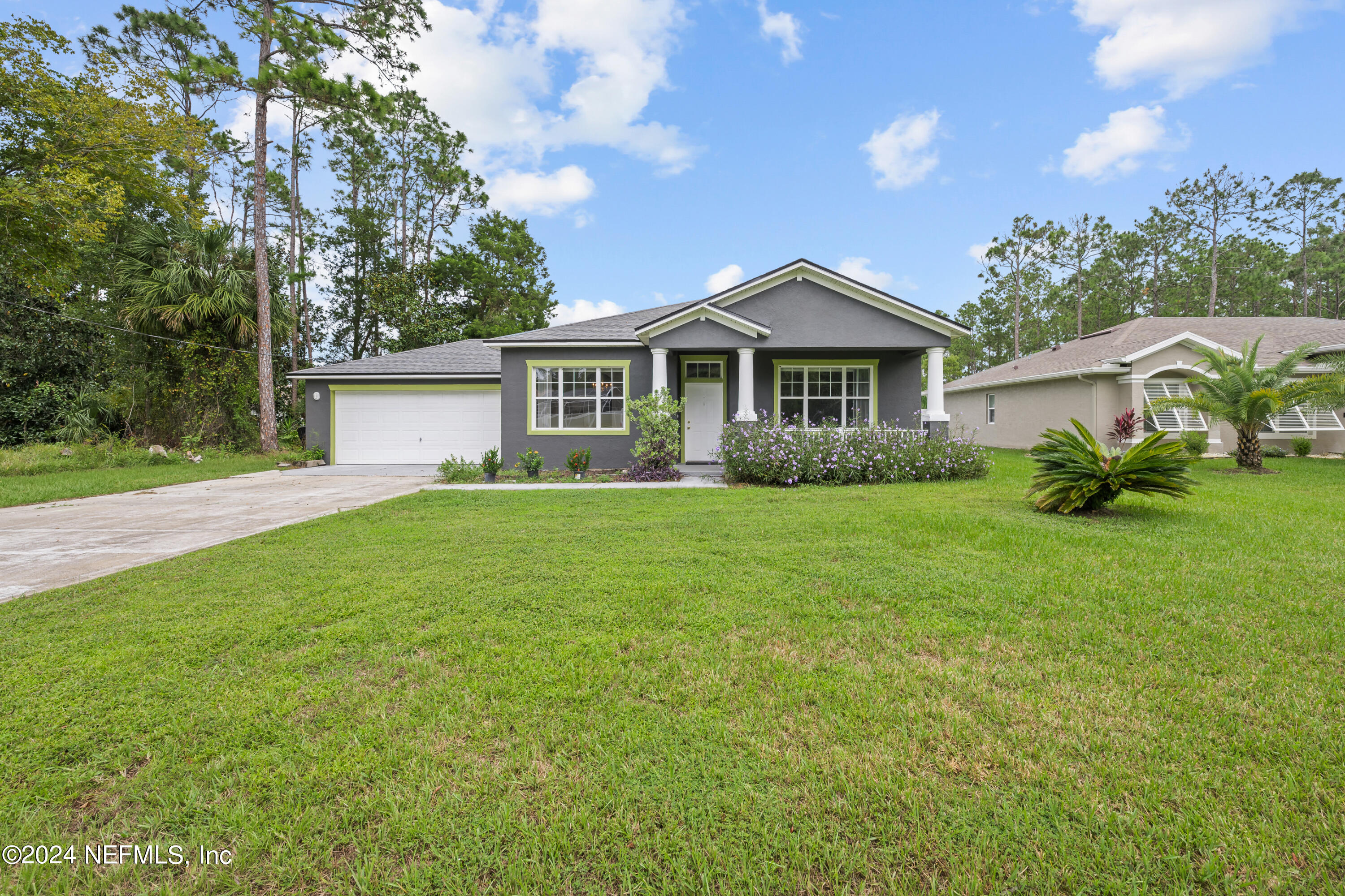 26 Zonal Geranium Trail Palm Coast, FL 32164 - Photo 34 of 35 a front view of house with yard and green space
