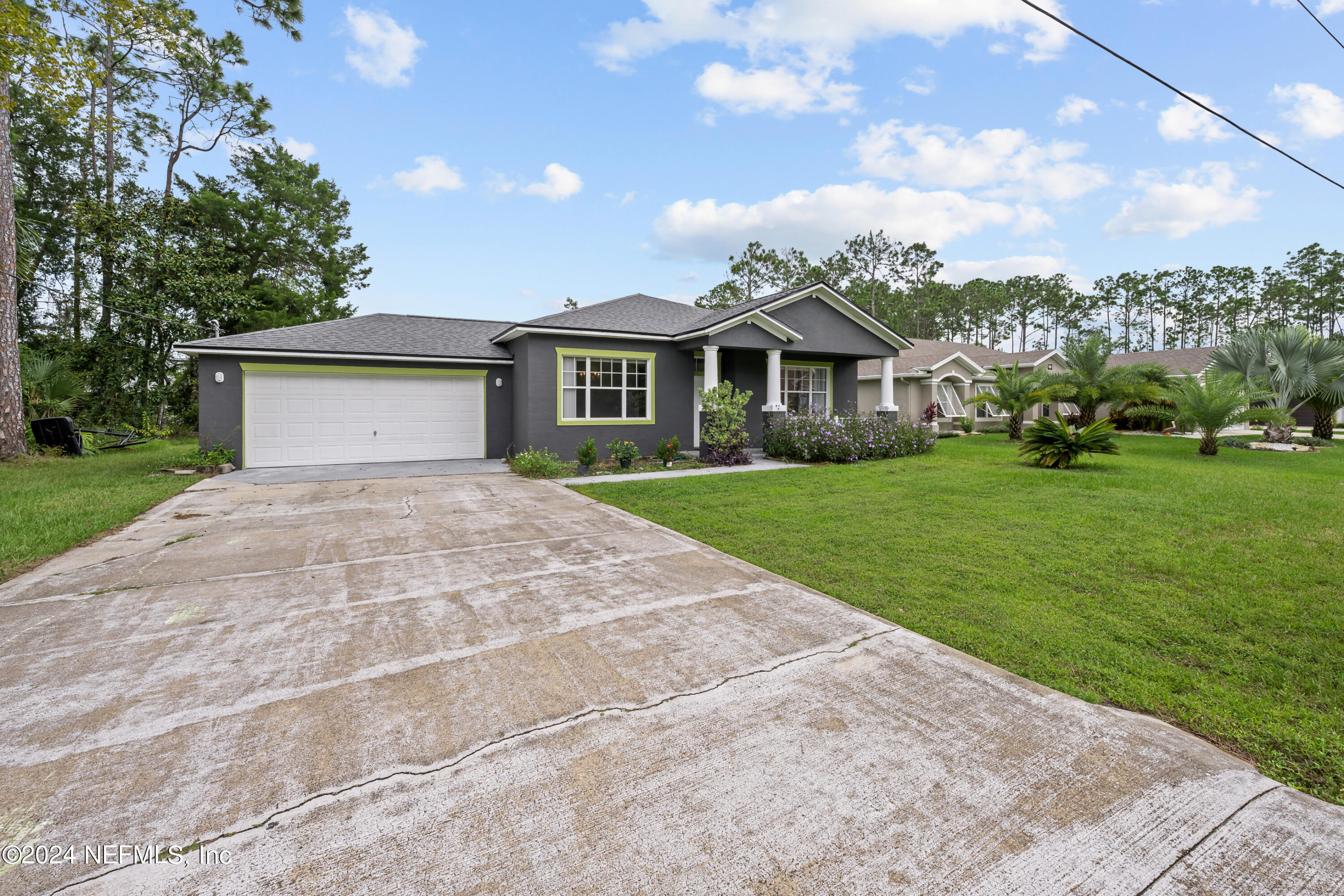 26 Zonal Geranium Trail Palm Coast, FL 32164 - Photo 35 of 35 a front view of a house with garden