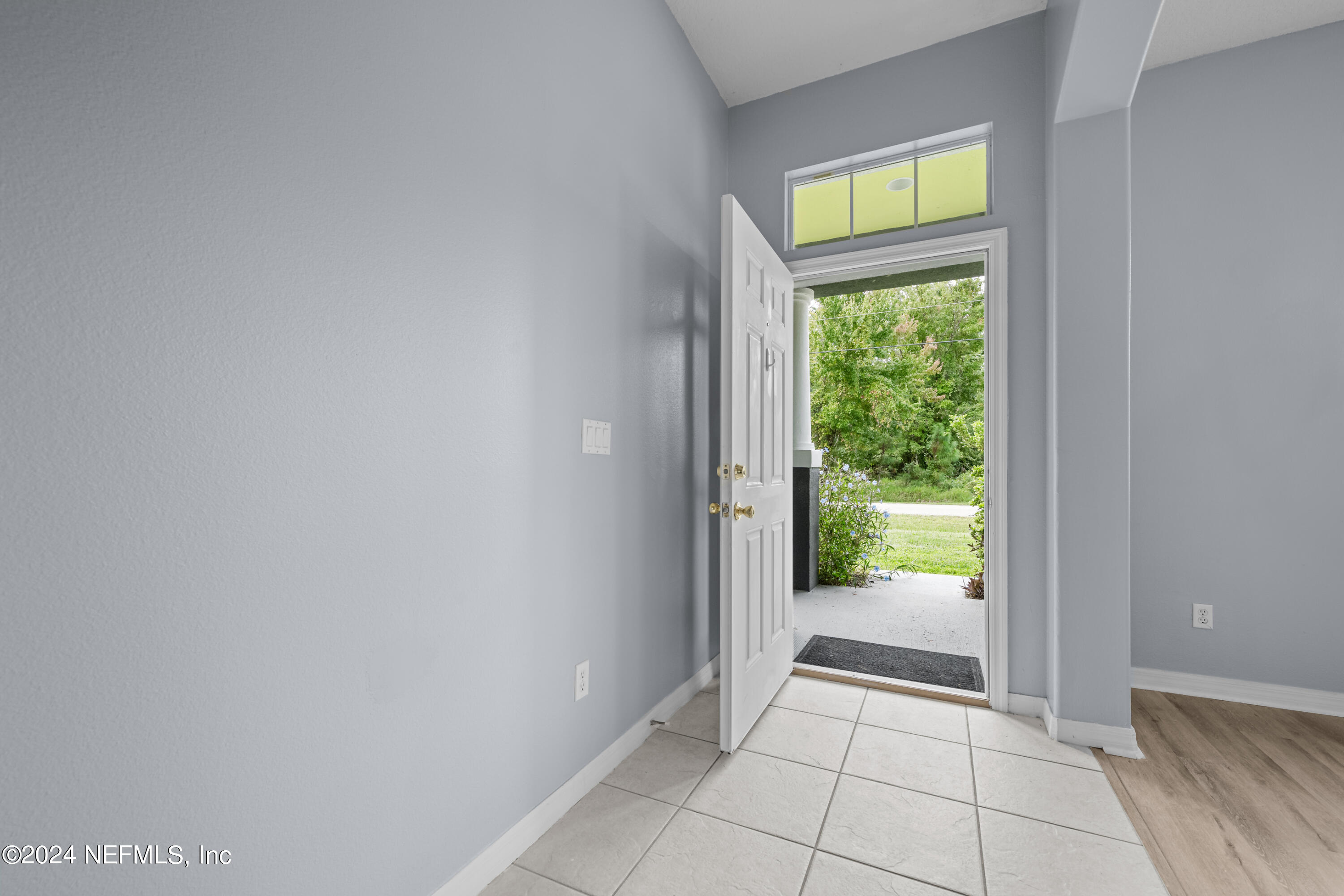 26 Zonal Geranium Trail Palm Coast, FL 32164 - Photo 4 of 35 a view of an entryway and a window