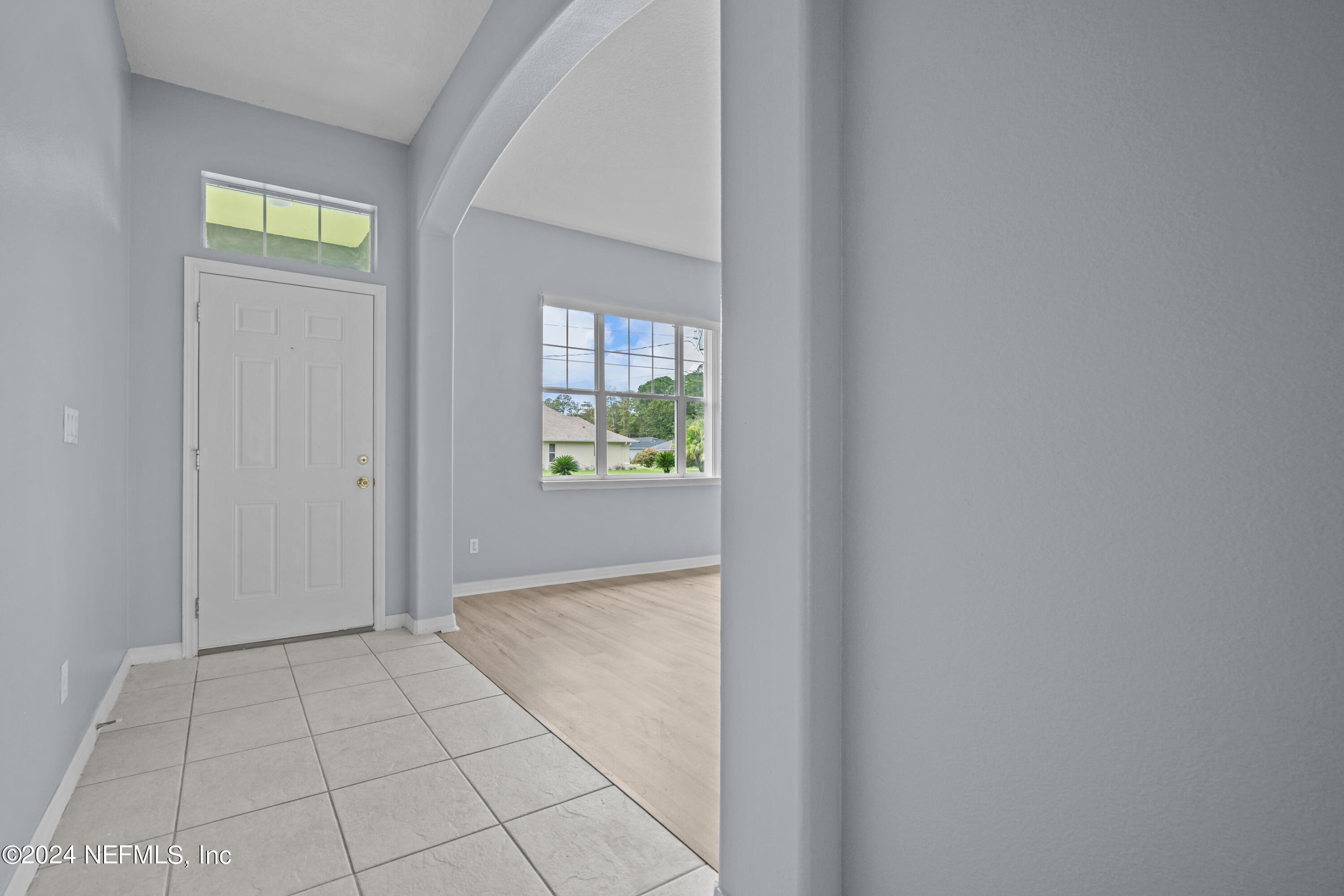 26 Zonal Geranium Trail Palm Coast, FL 32164 - Photo 5 of 35 a view of an entryway with window