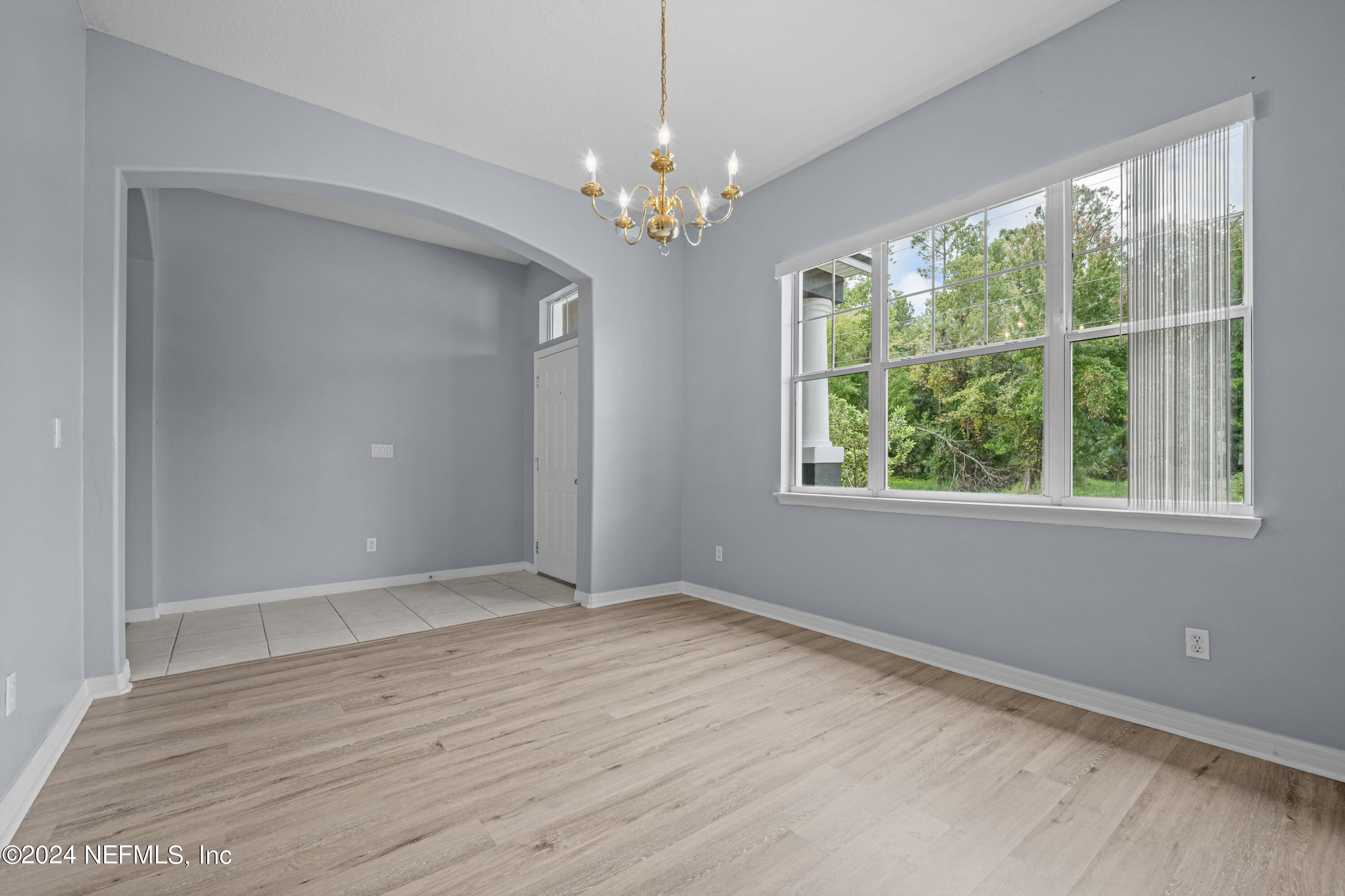 26 Zonal Geranium Trail Palm Coast, FL 32164 - Photo 8 of 35 wooden floor in an empty room with a window