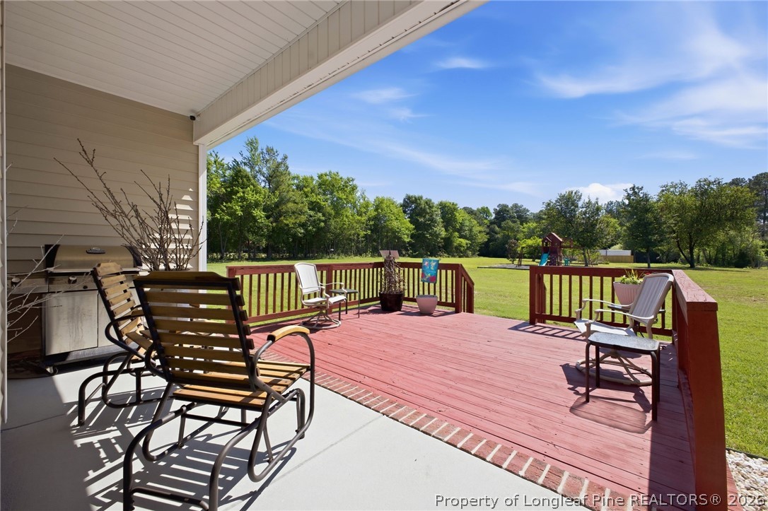 2589 June Johnson Road Raeford, NC 28376 - Photo 38 of 49 a view of a chairs and table on the terrace