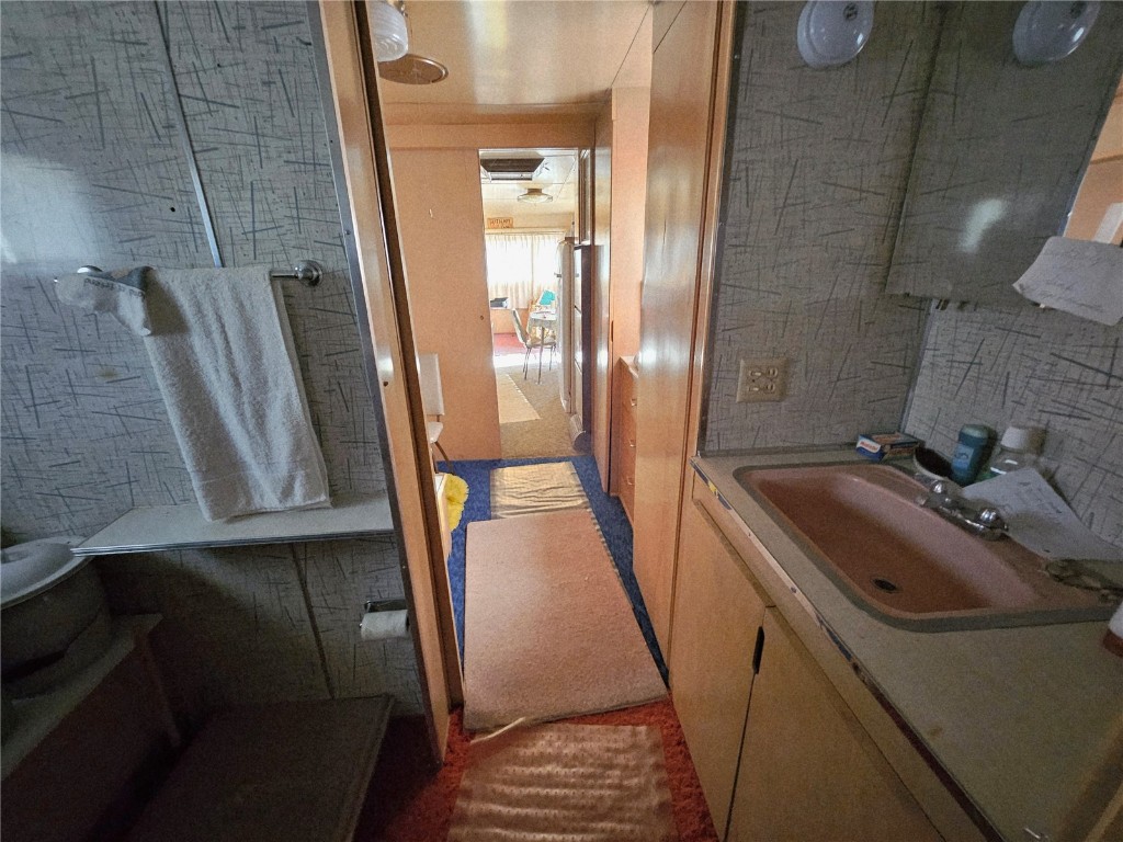 1404 Buffalo Ridge Road Como, CO 80432 - Photo 32 of 50 a bathroom with sink and mirror