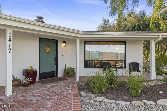 a large kitchen with lots of counter space and a sink