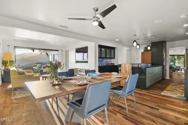 a bathroom with a sink a toilet a mirror and shower