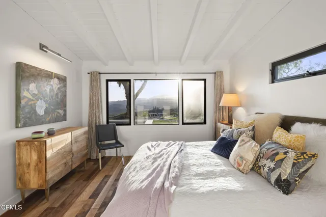 a view of a storage and utility room with washer and dryer