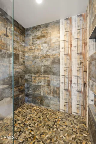 a bathroom with a bathtub and shower