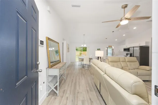 a kitchen with stainless steel appliances a refrigerator sink stove microwave and cabinets