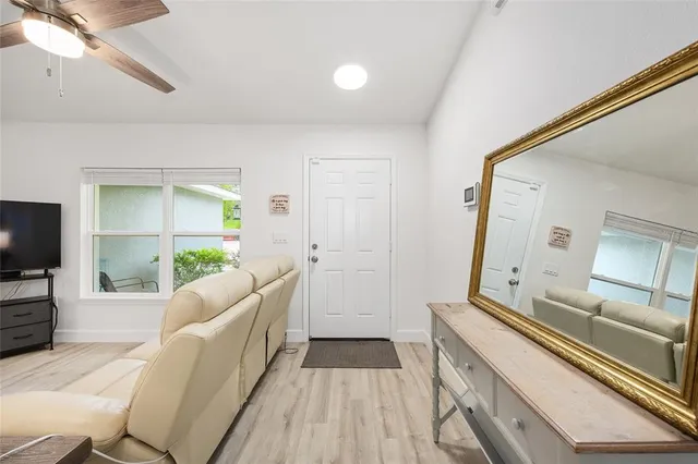a kitchen with stainless steel appliances a refrigerator and microwave