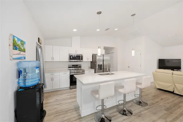 an aerial view of house with yard swimming pool and outdoor seating