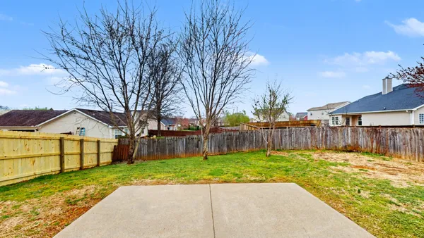 a view of a backyard with a small cabin
