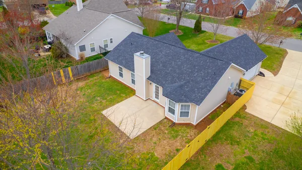 an aerial view of a house with swimming pool