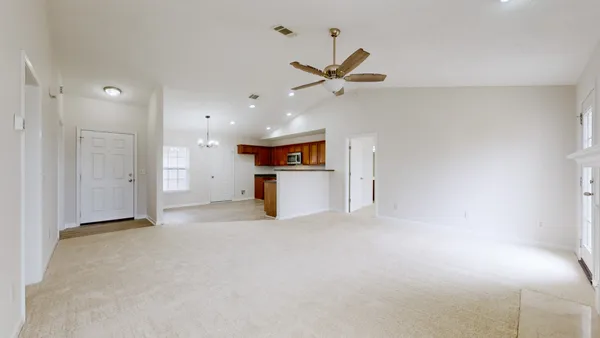 a view of a kitchen with a sink and cabinet