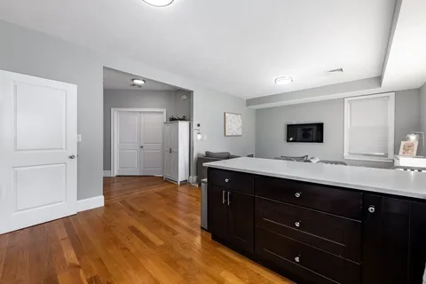 a spacious bathroom with a sink and a mirror