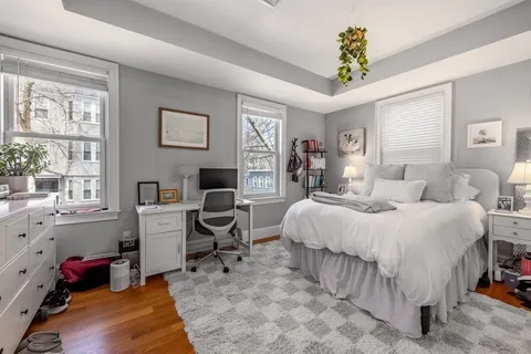 a bedroom with a bed and a desk