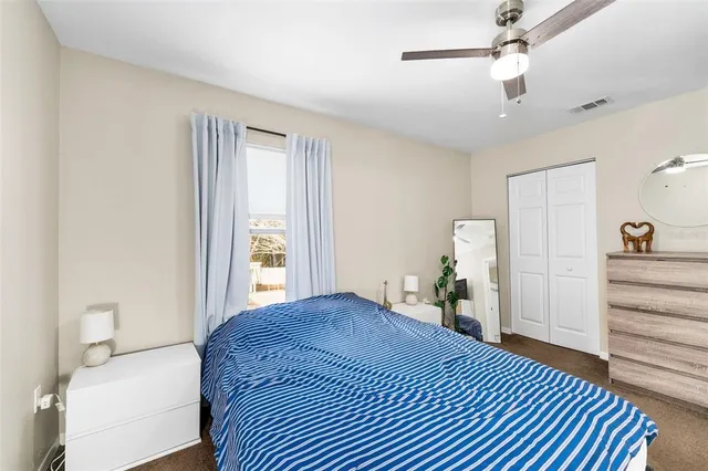 a bed room with a bed and a window