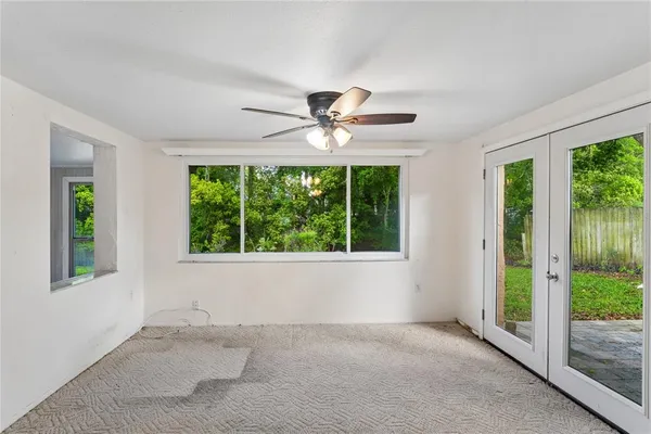 a view of an empty room with a window