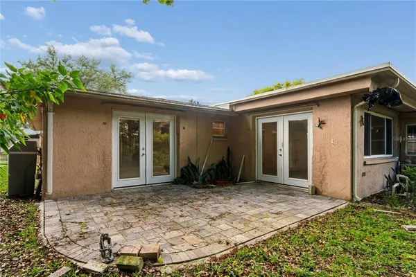 a view of house with backyard