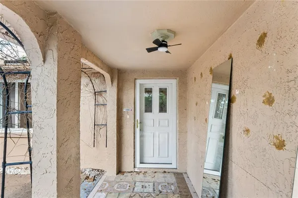 a view of a bathroom with a shower and closet