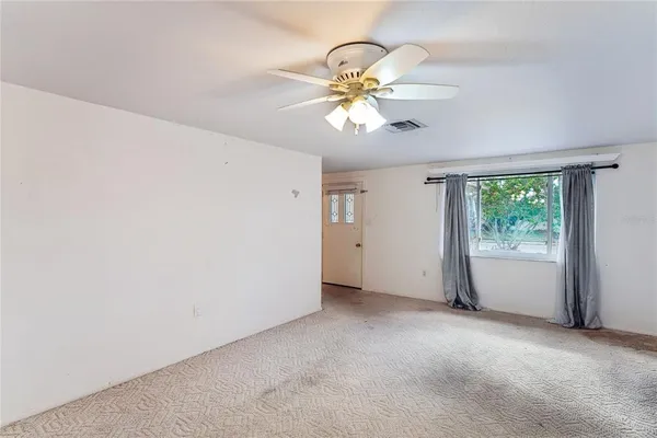 a view of an empty room with a window