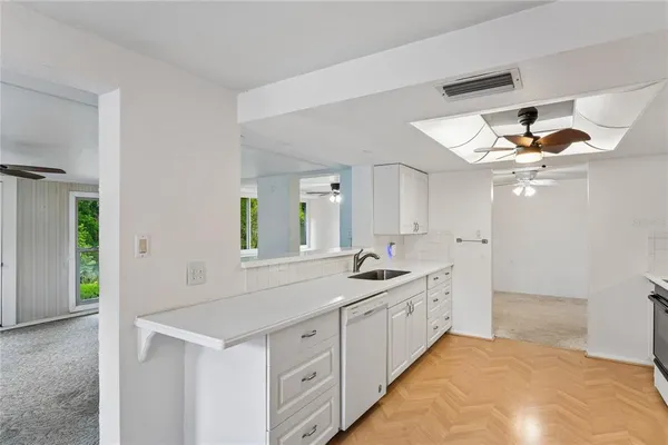 a spacious bathroom with a double vanity sink and a mirror