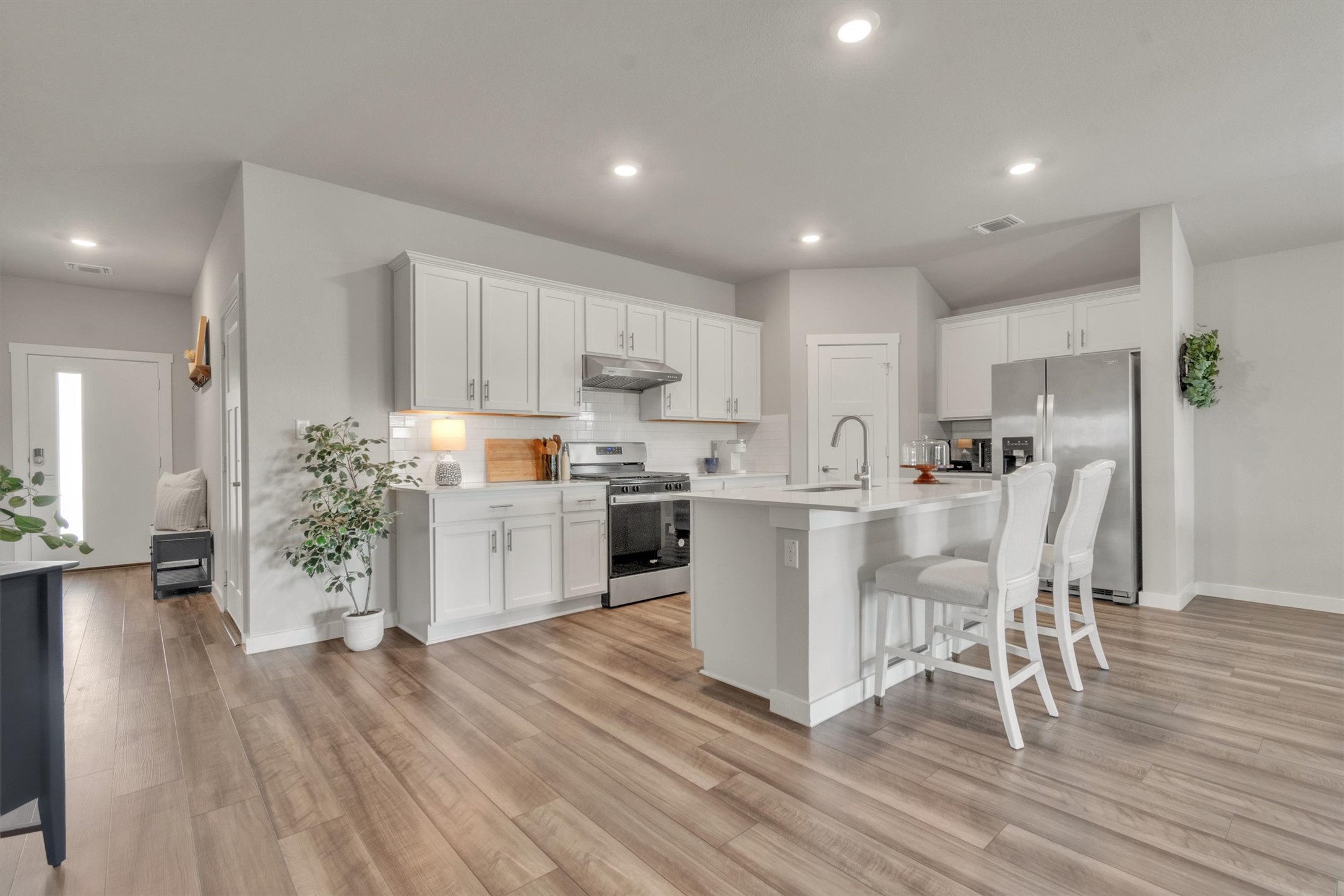 1008 Tipton Street Georgetown, TX 78633 - Photo 2 of 38 Huge kitchen with ample room to move around. Chef's dream with natural gas cooking and custom stainless vented hood