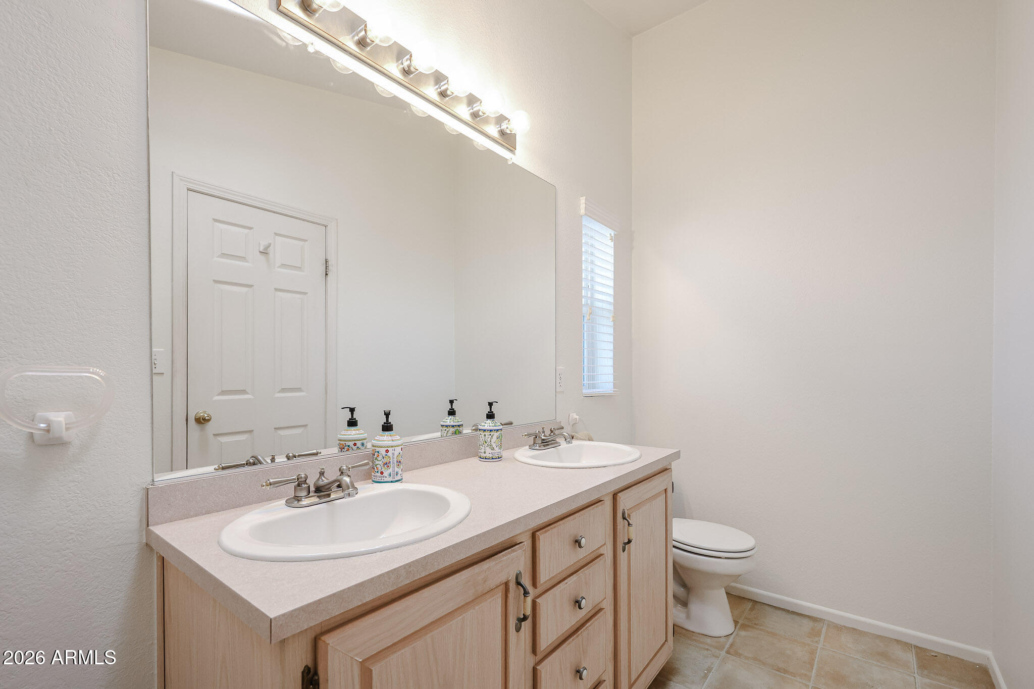 3901 East Pinnacle Peak Road, Unit 270 Phoenix, AZ 85050 - Photo 15 of 27 a bathroom with a sink and a mirror