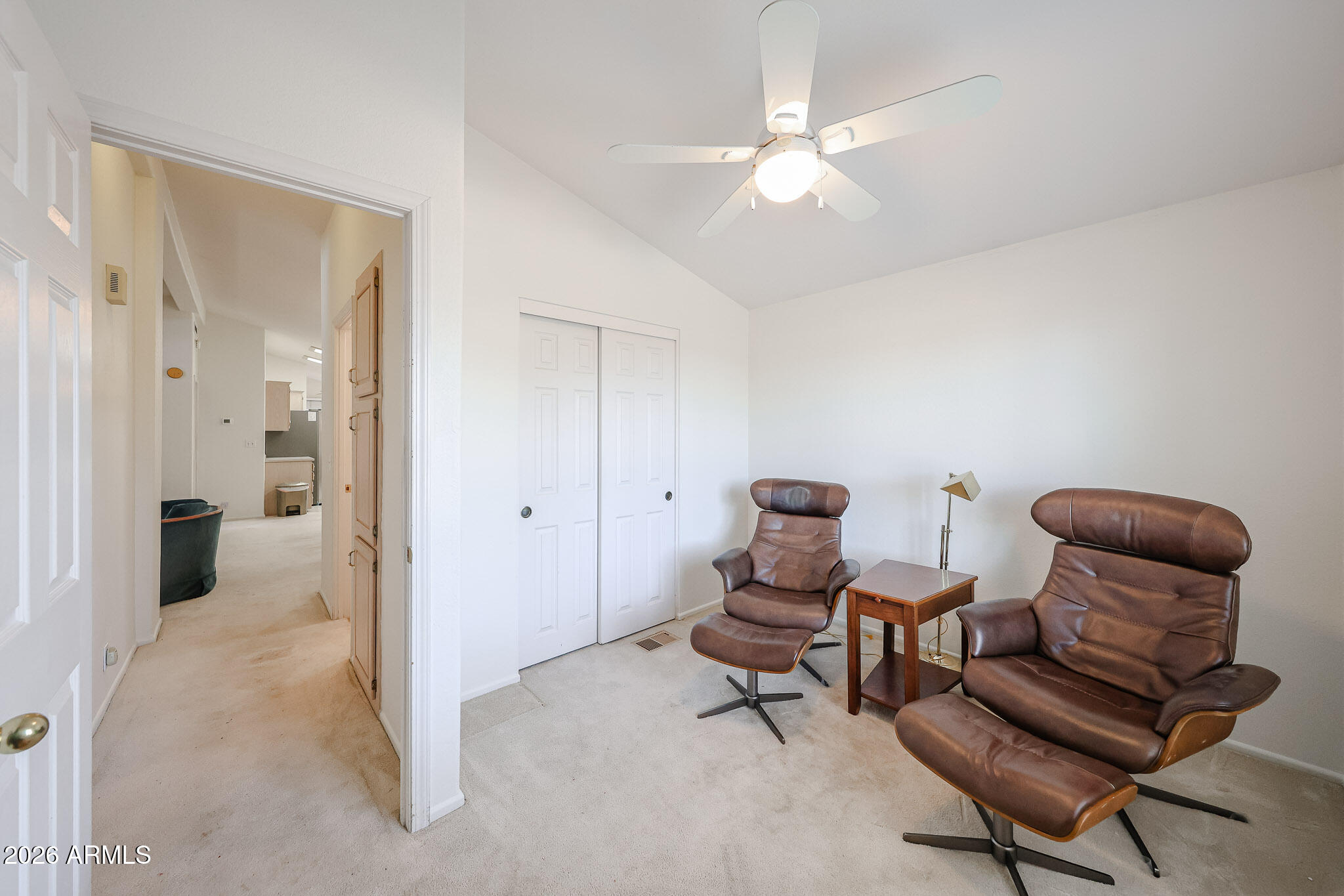 3901 East Pinnacle Peak Road, Unit 270 Phoenix, AZ 85050 - Photo 18 of 27 a living room with furniture and a chandelier
