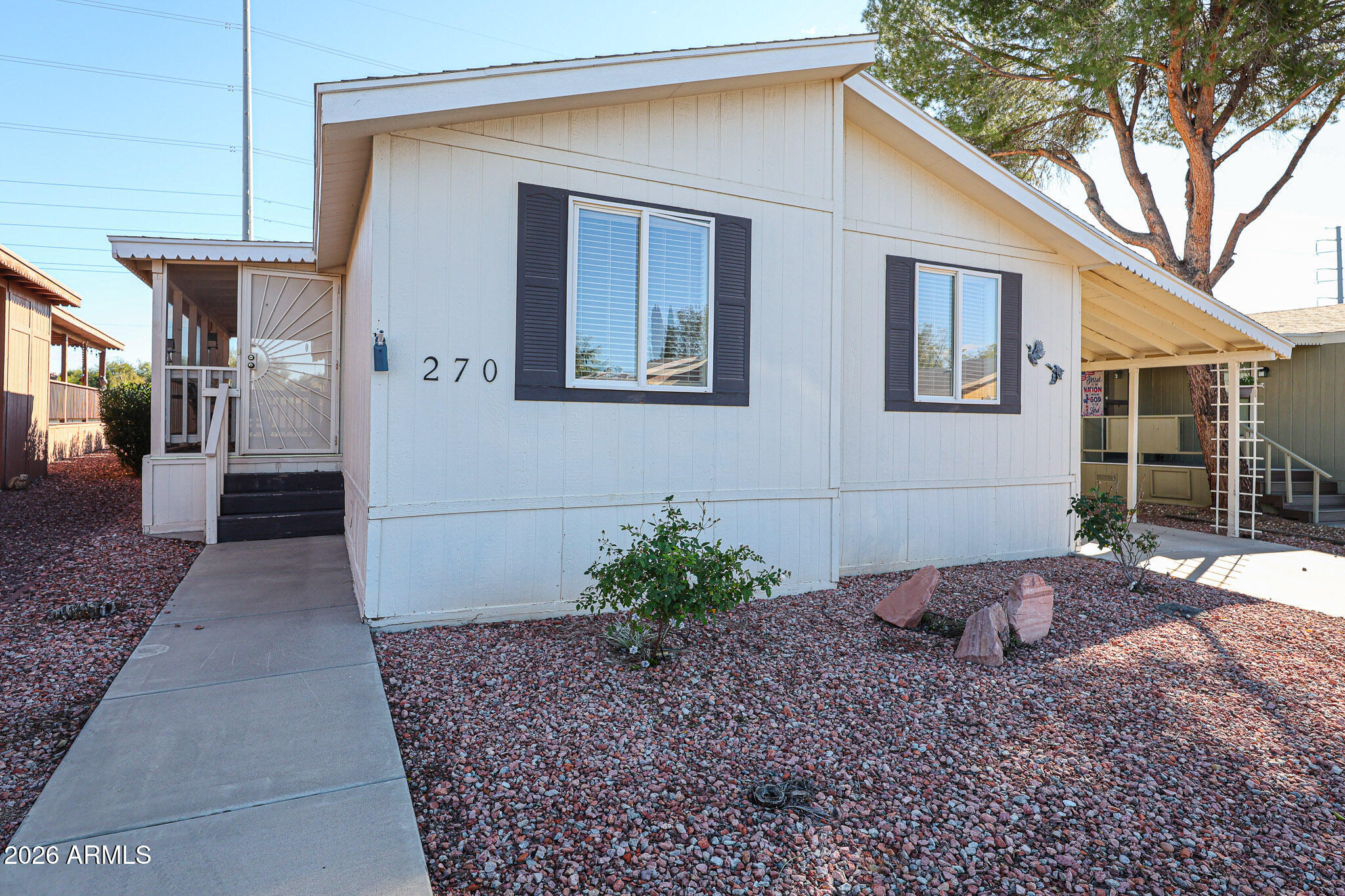 3901 East Pinnacle Peak Road, Unit 270 Phoenix, AZ 85050 - Photo 2 of 27 a view of a house with a yard