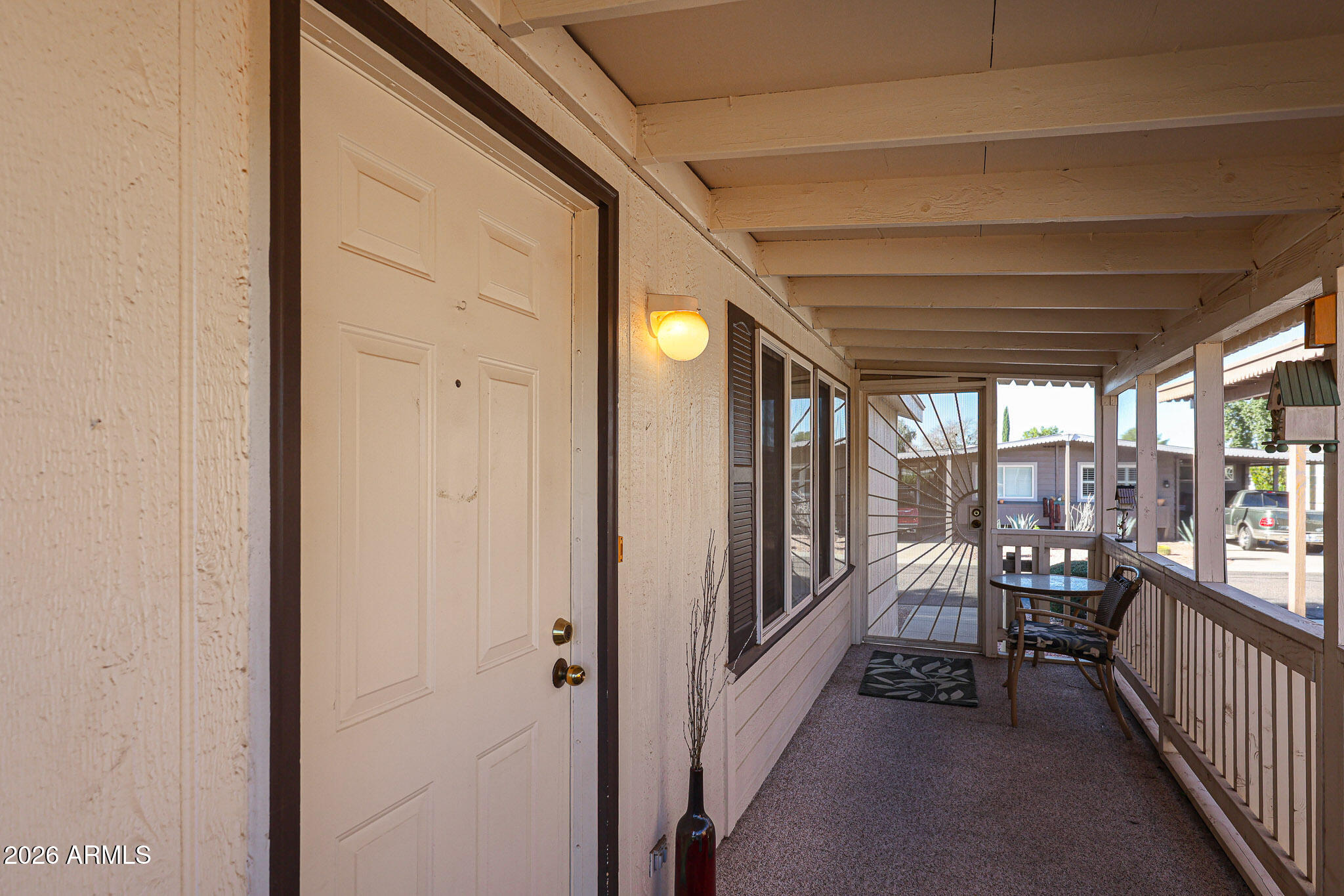 3901 East Pinnacle Peak Road, Unit 270 Phoenix, AZ 85050 - Photo 21 of 27 a view of a porch and chairs in the balcony